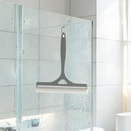 Silicone shower squeegee on glass tile
